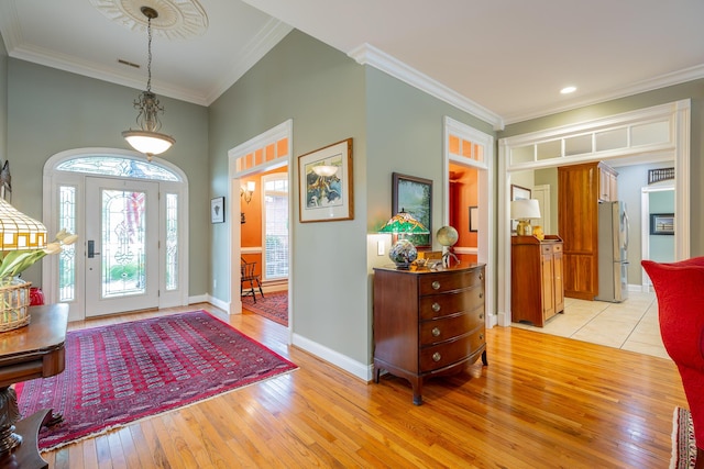 9548 Shadow Crossing Ln, Chattanooga, TN 37421 - foyer with light wood-style flooring, crown molding, and baseboards