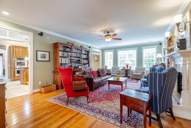 9548 Shadow Crossing Ln, Chattanooga, TN 37421 - living area with light wood-type flooring, ceiling fan, ornamental molding, a fireplace, and baseboards
