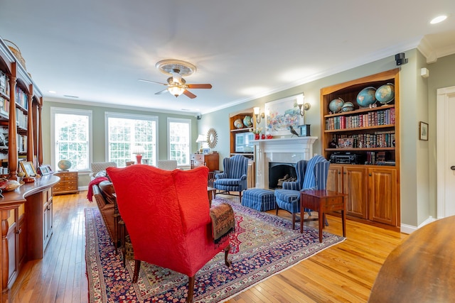 9548 Shadow Crossing Ln, Chattanooga, TN 37421 - living room with light wood-style floors, a ceiling fan, crown molding, a fireplace, and recessed lighting