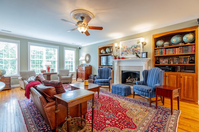 9548 Shadow Crossing Ln, Chattanooga, TN 37421 - living room featuring ornamental molding, ceiling fan, light wood finished floors, a fireplace, and baseboards