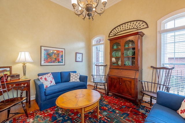 9548 Shadow Crossing Ln, Chattanooga, TN 37421 - living room with a chandelier, baseboards, dark wood-style flooring, and ornamental molding