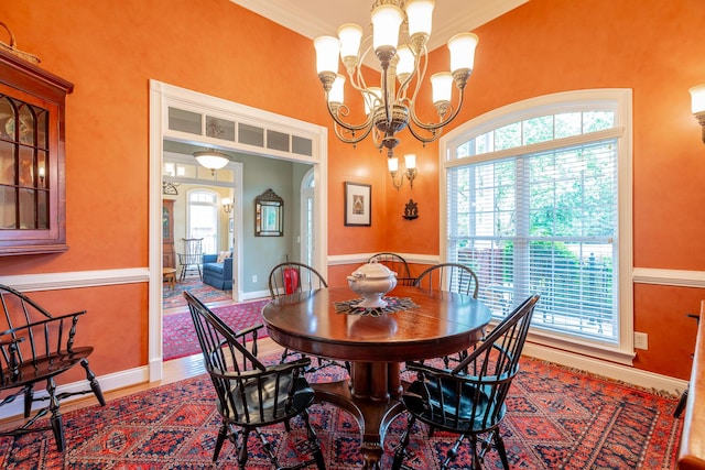 9548 Shadow Crossing Ln, Chattanooga, TN 37421 - dining space featuring plenty of natural light, arched walkways, a chandelier, baseboards, and ornamental molding