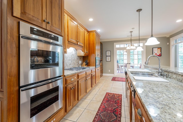 9548 Shadow Crossing Ln, Chattanooga, TN 37421 - kitchen featuring a sink, stainless steel appliances, brown cabinets, backsplash, and french doors
