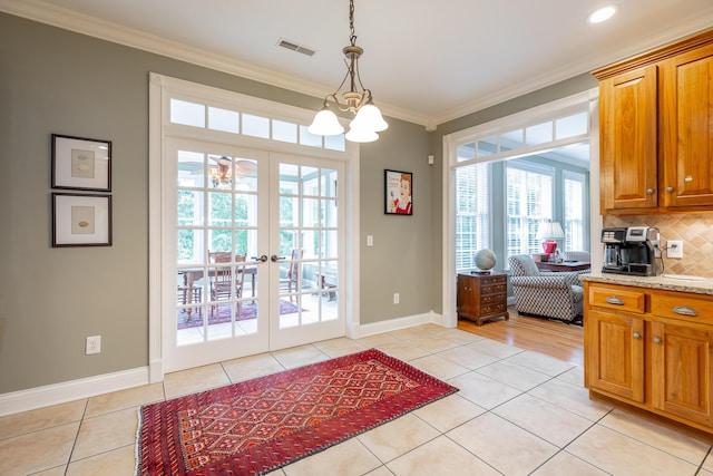 9548 Shadow Crossing Ln, Chattanooga, TN 37421 - entryway with healthy amount of natural light, light tile patterned floors, ornamental molding, a chandelier, and baseboards