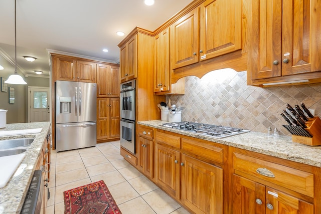 9548 Shadow Crossing Ln, Chattanooga, TN 37421 - kitchen with appliances with stainless steel finishes, backsplash, brown cabinets, light stone countertops, and crown molding