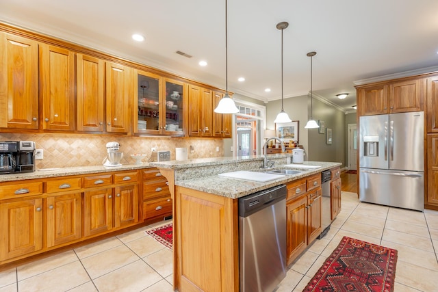 9548 Shadow Crossing Ln, Chattanooga, TN 37421 - kitchen with stainless steel appliances, a sink, brown cabinets, ornamental molding, and light tile patterned floors