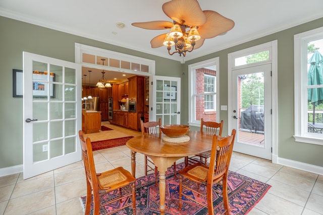 9548 Shadow Crossing Ln, Chattanooga, TN 37421 - dining room with crown molding, a chandelier, light tile patterned floors, and baseboards