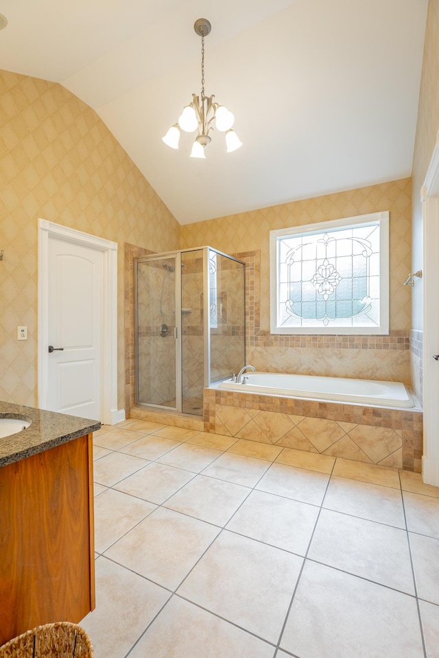 9548 Shadow Crossing Ln, Chattanooga, TN 37421 - full bathroom with vaulted ceiling, tile patterned floors, a chandelier, a garden tub, and vanity