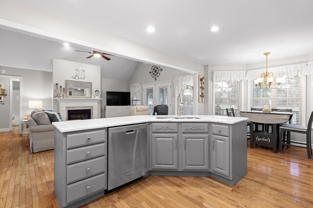 102 Water Mill Trce, Ringgold, GA 30736 - kitchen featuring stainless steel dishwasher, gray cabinetry, light wood-style floors, light countertops, and vaulted ceiling