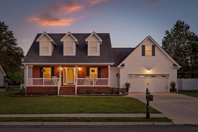 102 Water Mill Trce, Ringgold, GA 30736 - cape cod-style house featuring an attached garage, concrete driveway, brick siding, and covered porch