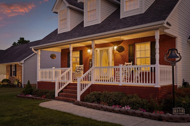 102 Water Mill Trce, Ringgold, GA 30736 - view of front facade with a porch, brick siding, roof with shingles, and a lawn