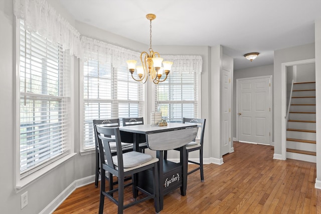 102 Water Mill Trce, Ringgold, GA 30736 - dining space with a chandelier, stairway, healthy amount of natural light, and wood finished floors