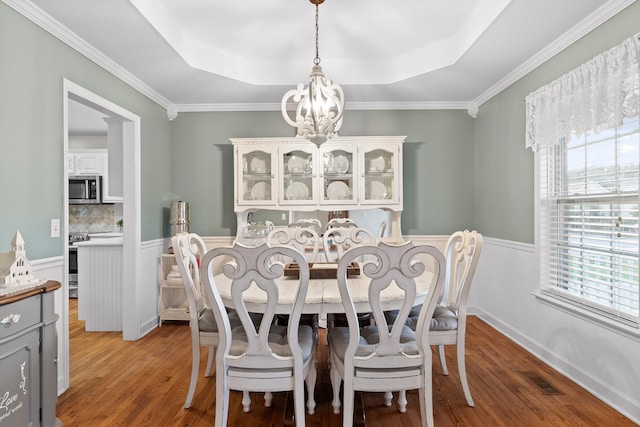 102 Water Mill Trce, Ringgold, GA 30736 - dining area featuring a raised ceiling, plenty of natural light, light wood finished floors, and ornamental molding