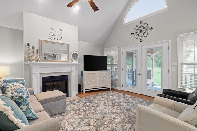 102 Water Mill Trce, Ringgold, GA 30736 - living room featuring ceiling fan, high vaulted ceiling, wood finished floors, a high end fireplace, and french doors