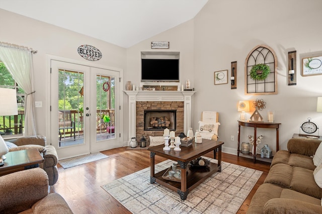 10807 Thatcher Crest Dr, Soddy Daisy, TN 37379 - living area featuring healthy amount of natural light, wood finished floors, high vaulted ceiling, and french doors