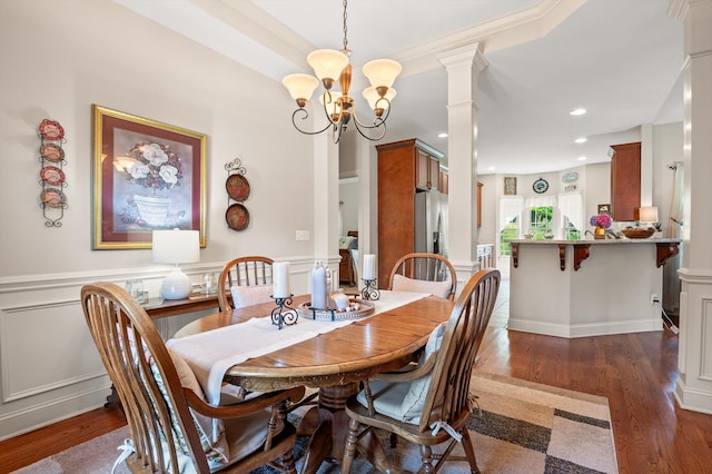 10807 Thatcher Crest Dr, Soddy Daisy, TN 37379 - dining area featuring a chandelier, dark wood-type flooring, recessed lighting, and decorative columns