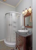 9704 Starry Way, Soddy Daisy, TN 37379 - bathroom with vanity, a stall shower, and crown molding