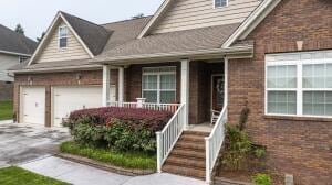 9704 Starry Way, Soddy Daisy, TN 37379 - view of front of house featuring brick siding, driveway, and a porch