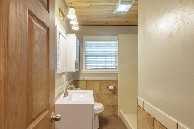 252 Valley View Dr, Dunlap, TN 37327 - bathroom featuring toilet, vanity, tile walls, a shower, and tile patterned flooring
