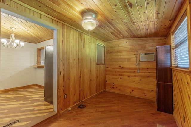 252 Valley View Dr, Dunlap, TN 37327 - spare room with wooden walls, wood ceiling, a chandelier, a wall mounted AC, and wood finished floors