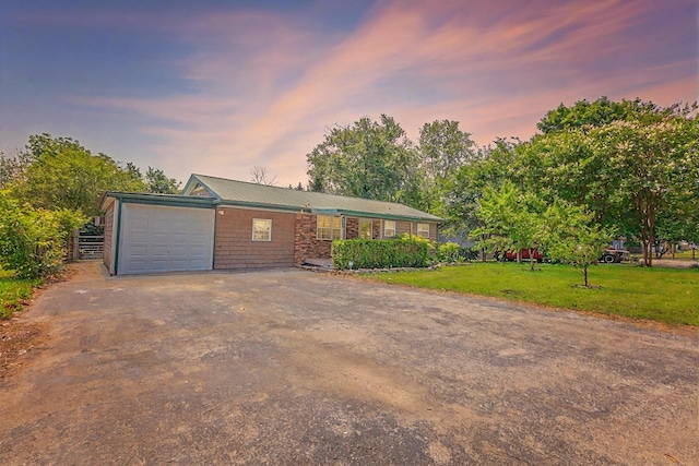 252 Valley View Dr, Dunlap, TN 37327 - ranch-style home featuring asphalt driveway, an attached garage, a lawn, and metal roof