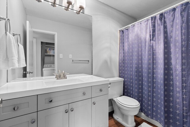 900 Mountain Creek Rd Unit P234, Chattanooga, TN 37405 - bathroom with washer / dryer, vanity, wood finished floors, toilet, and curtained shower