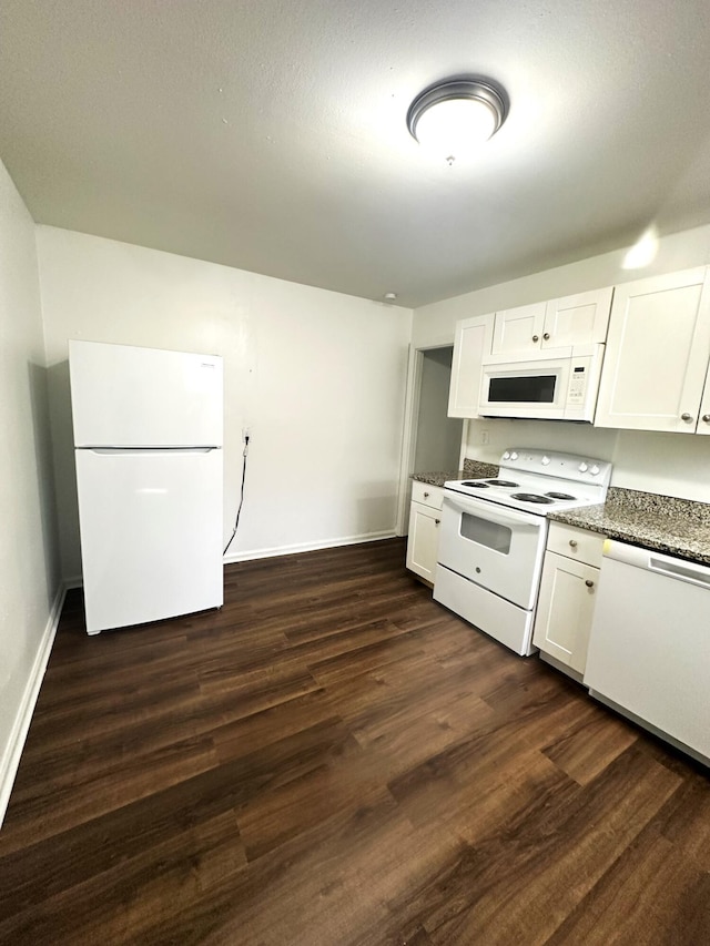 2011 Milne St, Chattanooga, TN 37406 - kitchen featuring white appliances, white cabinetry, dark wood-style floors, and dark stone counters