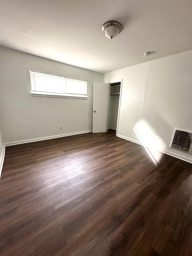 2011 Milne St, Chattanooga, TN 37406 - unfurnished bedroom featuring dark wood-type flooring and a closet