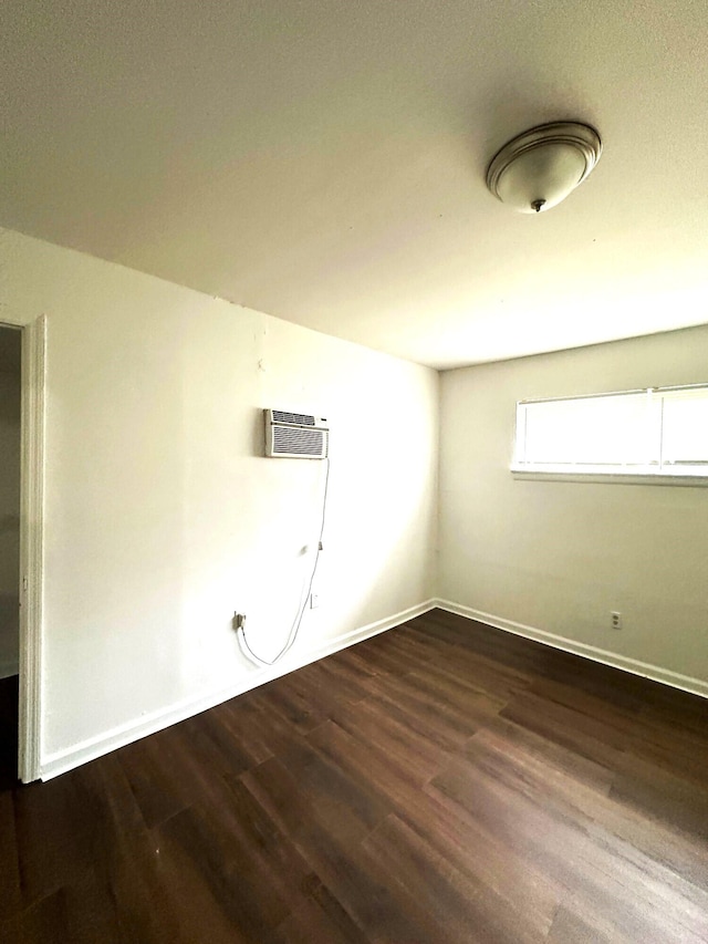 2011 Milne St, Chattanooga, TN 37406 - empty room with wood finished floors and an AC wall unit