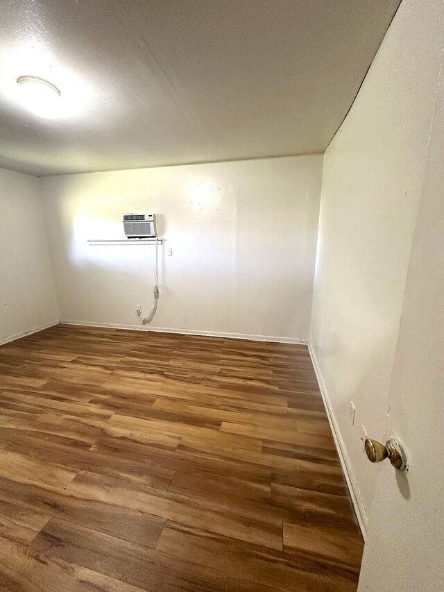 2011 Milne St, Chattanooga, TN 37406 - empty room featuring wood finished floors and a wall mounted AC