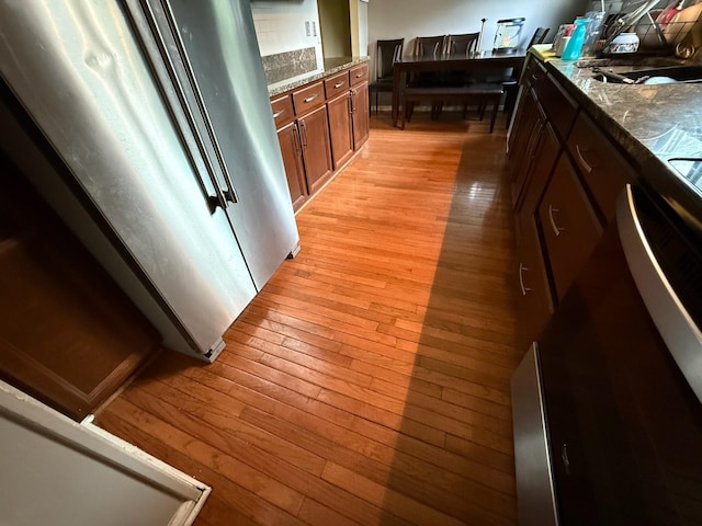 4509 Dumac Rd, Chattanooga, TN 37416 - kitchen featuring light wood-style flooring and brown cabinetry