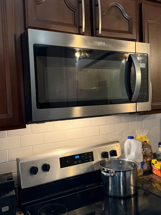 4509 Dumac Rd, Chattanooga, TN 37416 - kitchen view of stainless steel appliances, tasteful backsplash, and dark brown cabinets