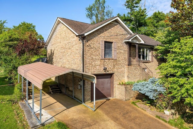 3606 Gleason Dr, Chattanooga, TN 37412 - view of property exterior with concrete driveway, a garage, and brick siding