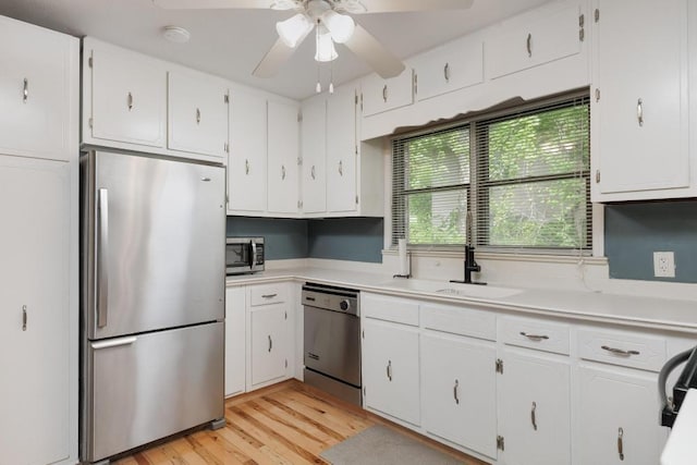 3606 Gleason Dr, Chattanooga, TN 37412 - kitchen with stainless steel appliances, ceiling fan, white cabinets, and light countertops