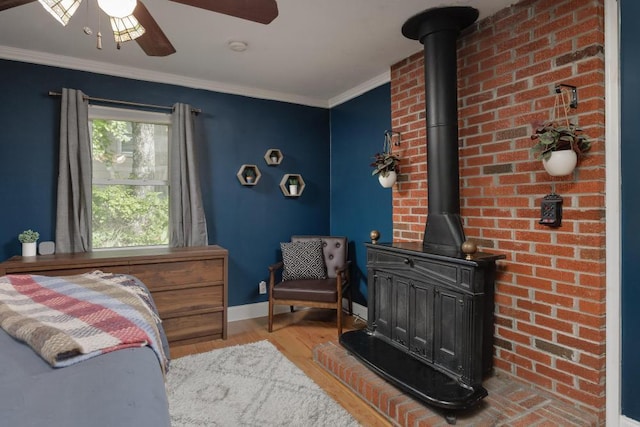 3606 Gleason Dr, Chattanooga, TN 37412 - bedroom with a wood stove, wood finished floors, crown molding, and ceiling fan