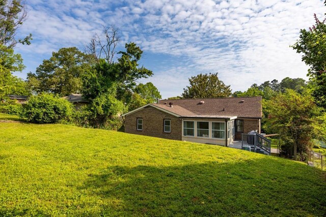 3606 Gleason Dr, Chattanooga, TN 37412 - rear view of property featuring a lawn and brick siding