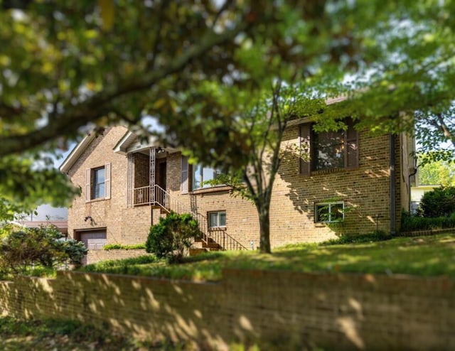 3606 Gleason Dr, Chattanooga, TN 37412 - view of home's exterior with brick siding and a garage