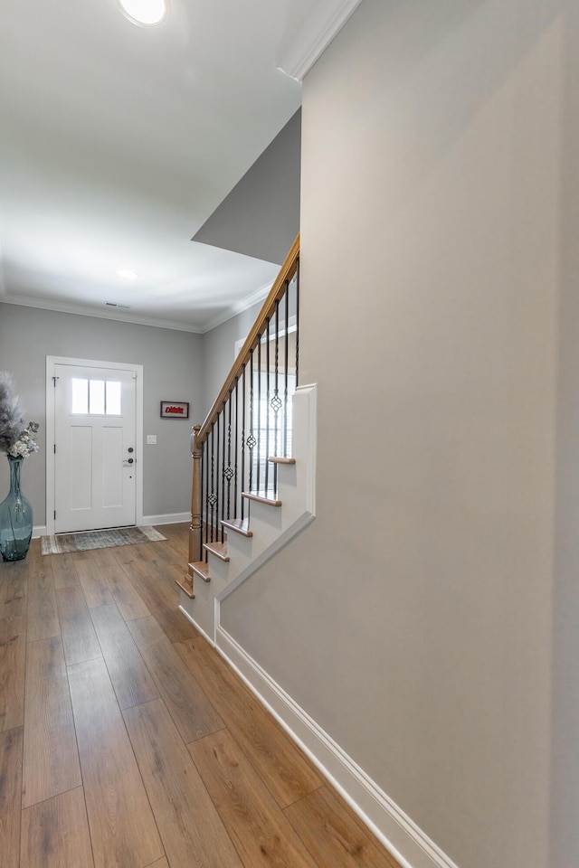 9058 Knolling Loop, Ooltewah, TN 37363 - entrance foyer with baseboards, stairs, hardwood / wood-style floors, and ornamental molding