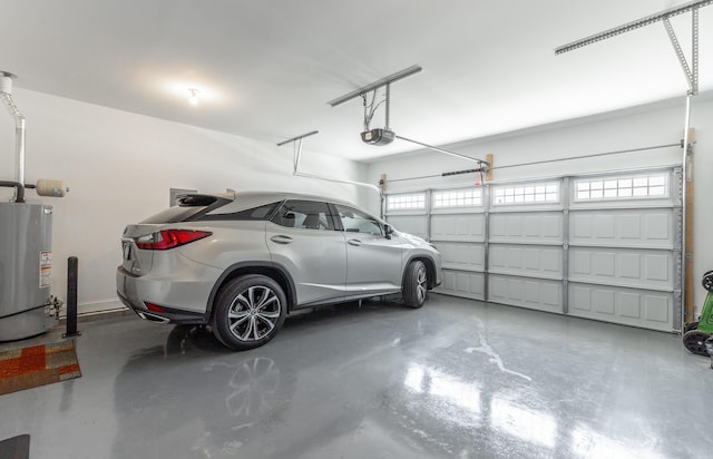 9058 Knolling Loop, Ooltewah, TN 37363 - garage featuring gas water heater and a garage door opener