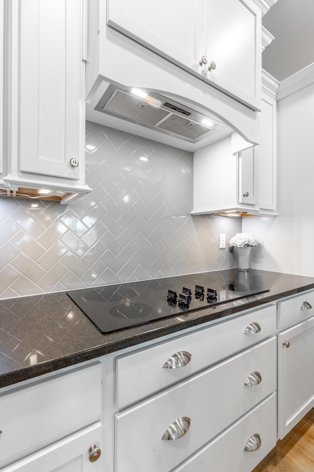 9058 Knolling Loop, Ooltewah, TN 37363 - kitchen featuring tasteful backsplash, white cabinetry, dark stone counters, and black electric cooktop