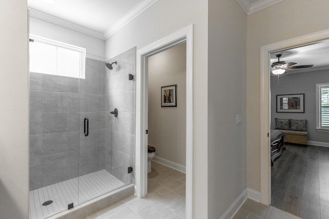 9058 Knolling Loop, Ooltewah, TN 37363 - ensuite bathroom featuring a shower stall, ornamental molding, toilet, a ceiling fan, and baseboards