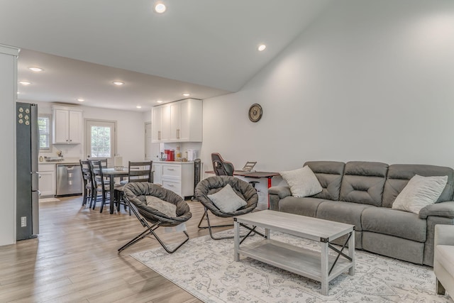 2091 Hummingbird Dr, Dalton, GA 30721 - living room with light wood finished floors, recessed lighting, and lofted ceiling