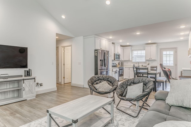 2091 Hummingbird Dr, Dalton, GA 30721 - living area with light wood-style floors, recessed lighting, and vaulted ceiling