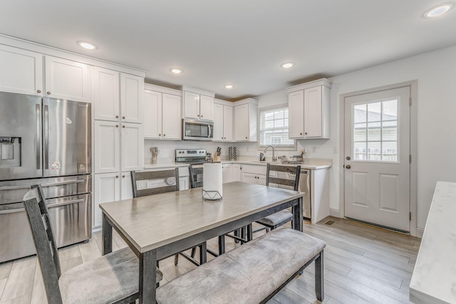 2091 Hummingbird Dr, Dalton, GA 30721 - dining area with light wood-style floors and recessed lighting