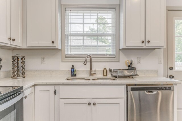 2091 Hummingbird Dr, Dalton, GA 30721 - kitchen with stainless steel dishwasher and white cabinets