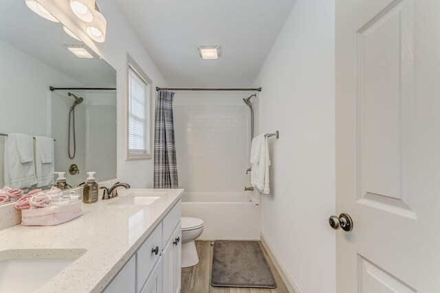 2091 Hummingbird Dr, Dalton, GA 30721 - bathroom with shower / bath combination with curtain, double vanity, and wood finished floors
