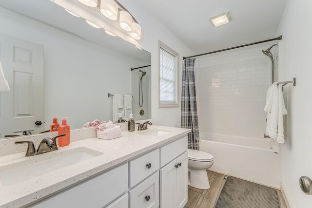2091 Hummingbird Dr, Dalton, GA 30721 - full bathroom with shower / bath combination with curtain, double vanity, and wood finished floors