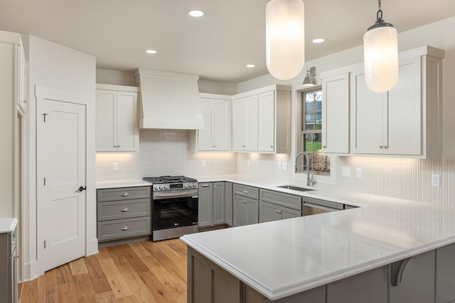 8654 Woodbury Acre Ct, Harrison, TN 37341 - kitchen featuring stainless steel appliances, a sink, custom range hood, gray cabinets, and light countertops