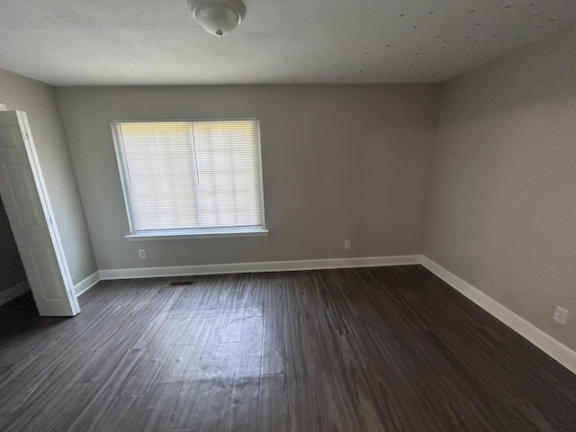 3955 Teakwood Dr, Chattanooga, TN 37416 - unfurnished room with baseboards and dark wood-style floors