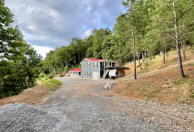 690 Ditch Gap Rd, Whitwell, TN 37397 - view of front of property with asphalt driveway, stairway, and a view of trees